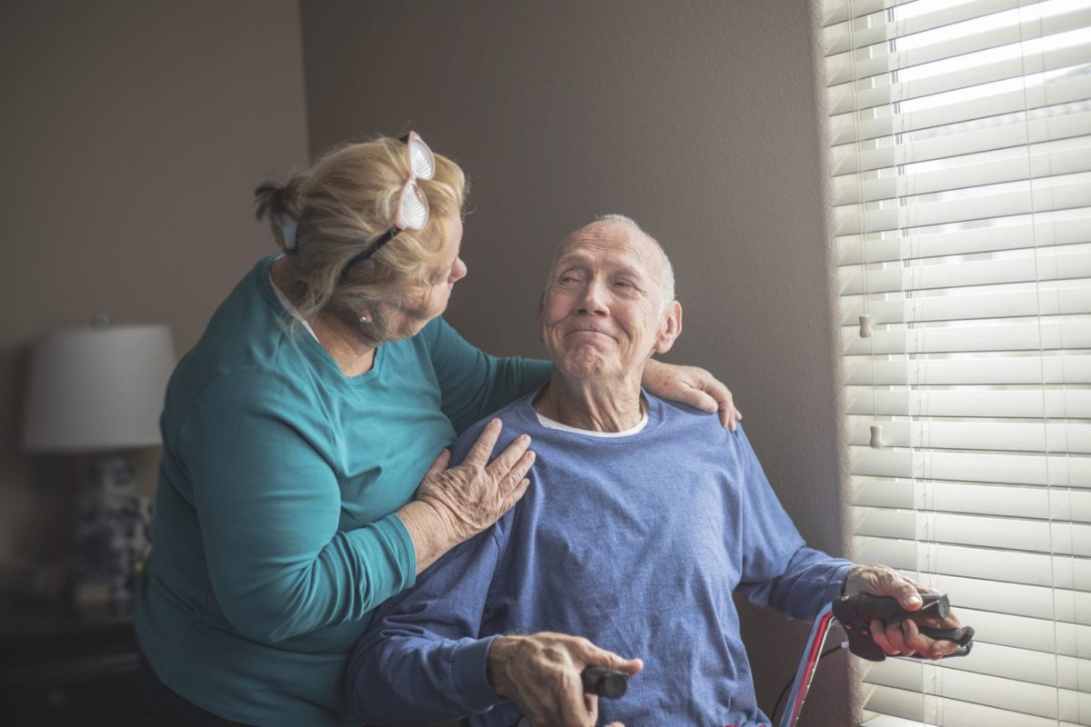 A hospice volunteer with patient.